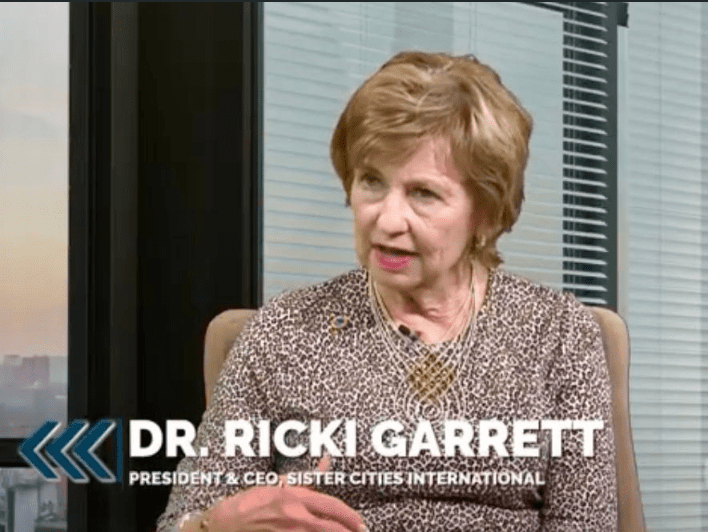 Woman speaking in an office setting.